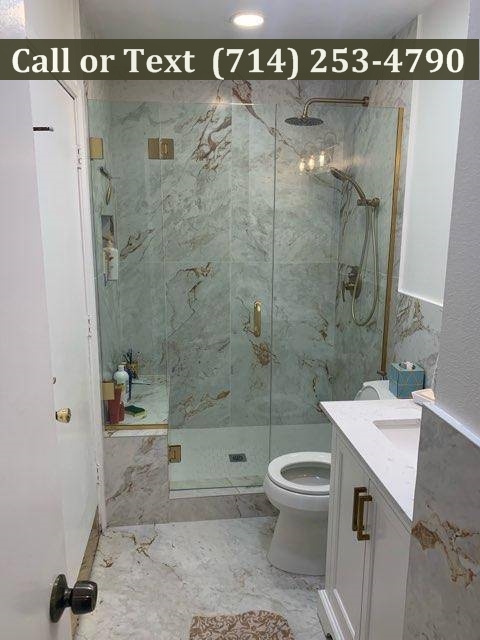 white and gold bath remodel fone